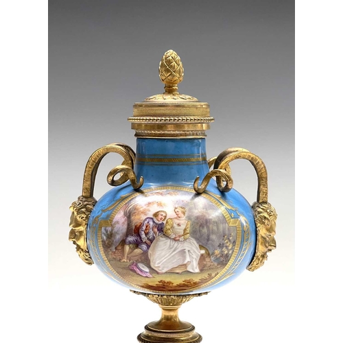 5 - A pair of French 'Sevres' porcelain ormolu mounted cassolettes, late 19th century, with horned mask ... 