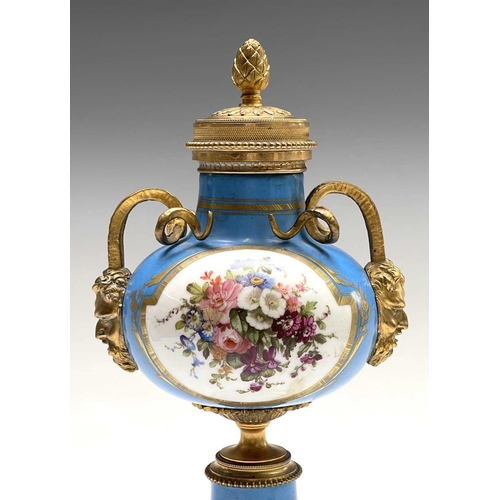 5 - A pair of French 'Sevres' porcelain ormolu mounted cassolettes, late 19th century, with horned mask ... 