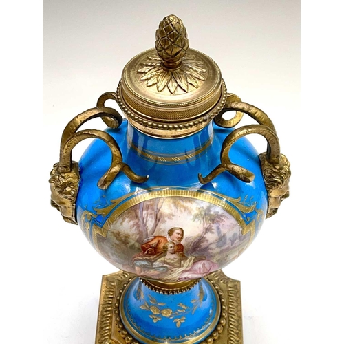 5 - A pair of French 'Sevres' porcelain ormolu mounted cassolettes, late 19th century, with horned mask ... 