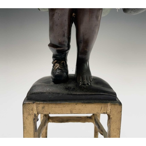 57 - After Juan Clena, a painted bronze sculpture of a girl standing on a stool. Height 37cm.