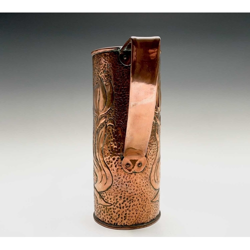 58 - An Arts & Crafts period copper twin handled vase, the cylindrical body repousse decorated with styli... 