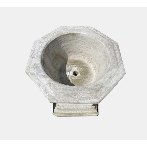 602 - A reconstituted stone Gothic font style planter, the octagonal bowl having relief quatrefoil panels.... 