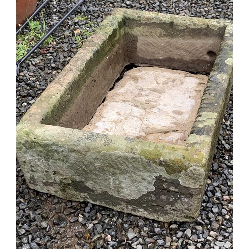 604 - A carved stone trough planter of rectangular form. Height 17cm, width 69cm, depth 40cm.