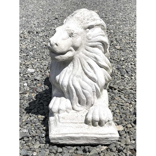 610 - A pair of white painted composition stone recumbent lion garden ornaments. Height 35cm, width 58cm, ... 