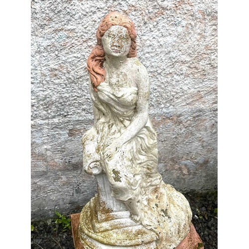 611 - A garden sculpture of a woman seated on a column. Height 76cm.