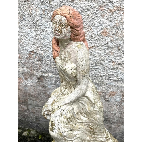 611 - A garden sculpture of a woman seated on a column. Height 76cm.