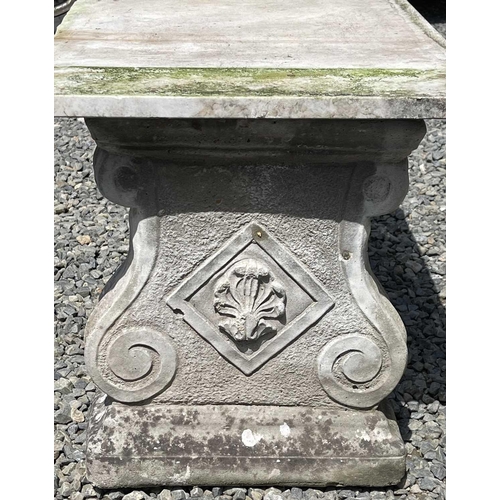 612 - A garden bench, the marble slab seat raised on a pair of composition stone supports. Height 42cm, wi... 