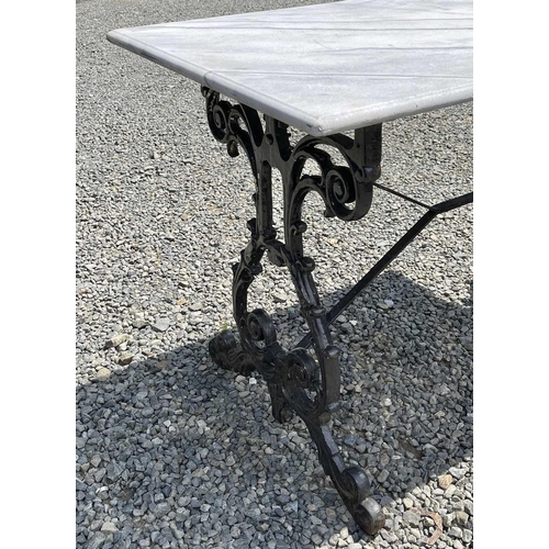 613 - A black painted cast iron garden table with rectangular marble top. Height 69.5cm, width 109cm, dept... 