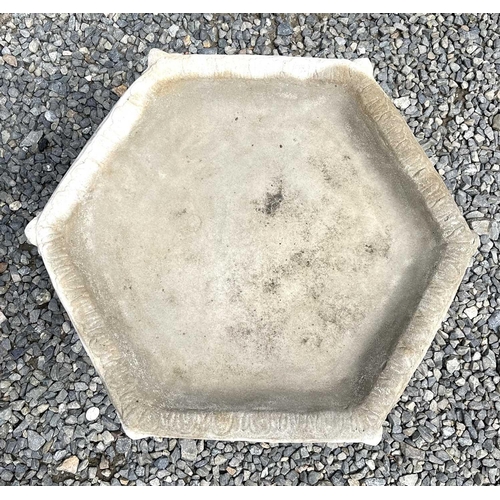 615 - A composition stone birdbath, the hexagonal top raised on a base with acanthus leaf decoration. Heig... 