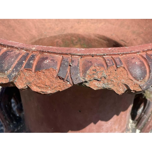 616 - A terracotta garden urn of campana form with egg and dart frieze. Height 62cm.