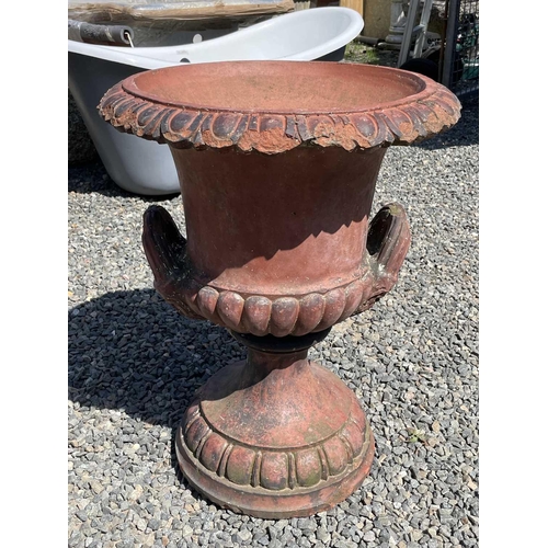 616 - A terracotta garden urn of campana form with egg and dart frieze. Height 62cm.