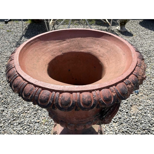 616 - A terracotta garden urn of campana form with egg and dart frieze. Height 62cm.