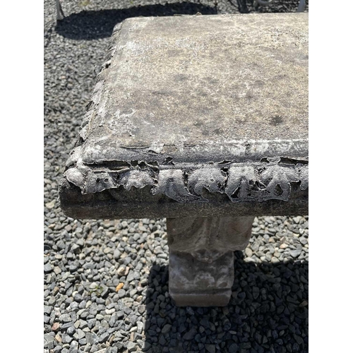 618 - A classical design garden bench raised on three supports. Height 41.5cm, width 118cm, depth 41cm.