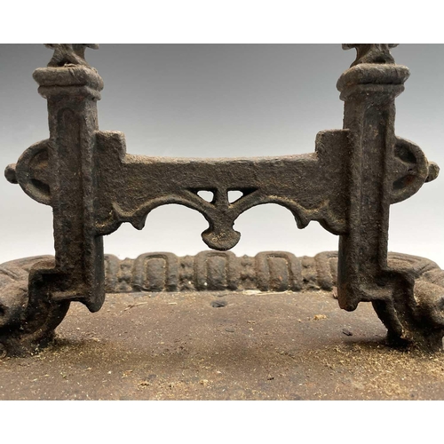 619 - A Victorian cast iron boot scraper of Gothic form. Width 40cm.