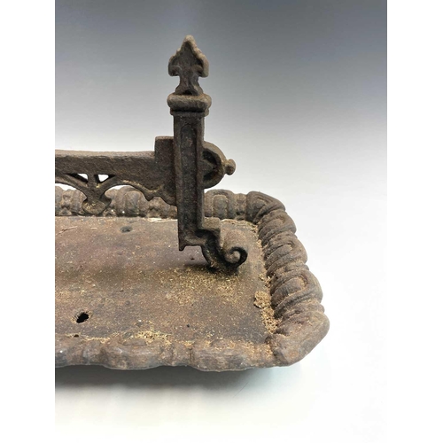 619 - A Victorian cast iron boot scraper of Gothic form. Width 40cm.