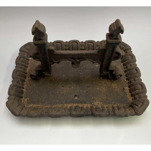 619 - A Victorian cast iron boot scraper of Gothic form. Width 40cm.