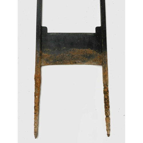 626 - A wrought iron boot scraper, in the Arts and Crafts style, the tall uprights with leaf terminals, he... 