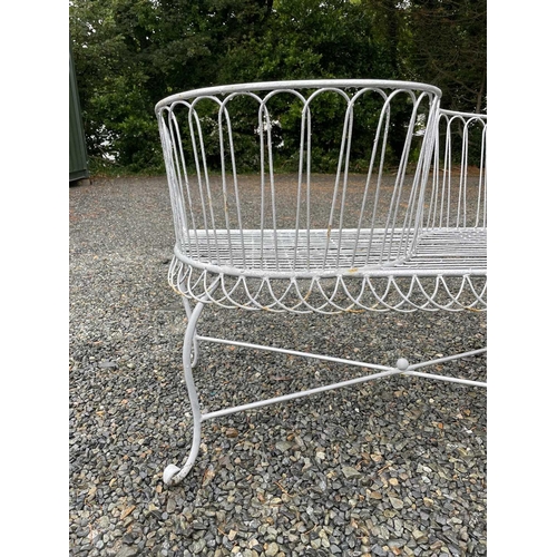 629 - A wrought iron garden love seat, width 116cm.