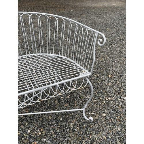 629 - A wrought iron garden love seat, width 116cm.