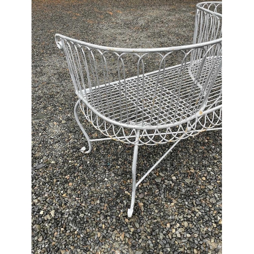 629 - A wrought iron garden love seat, width 116cm.