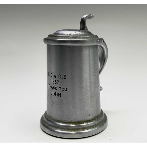 63 - A Dunhill lighter in the form of a pewter flagon, height 9cm, together with a cut glass scent bottle... 