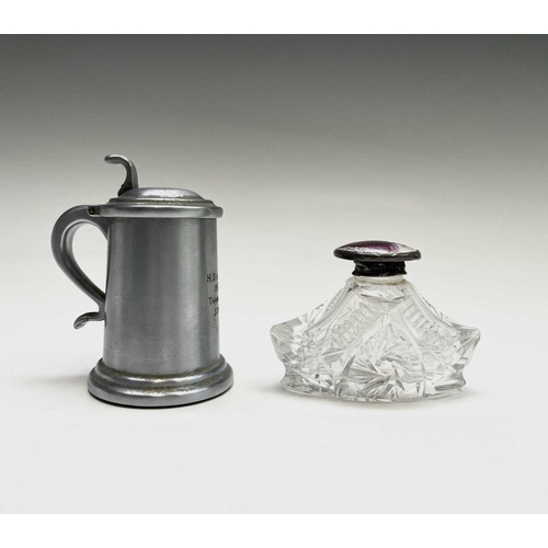 63 - A Dunhill lighter in the form of a pewter flagon, height 9cm, together with a cut glass scent bottle... 