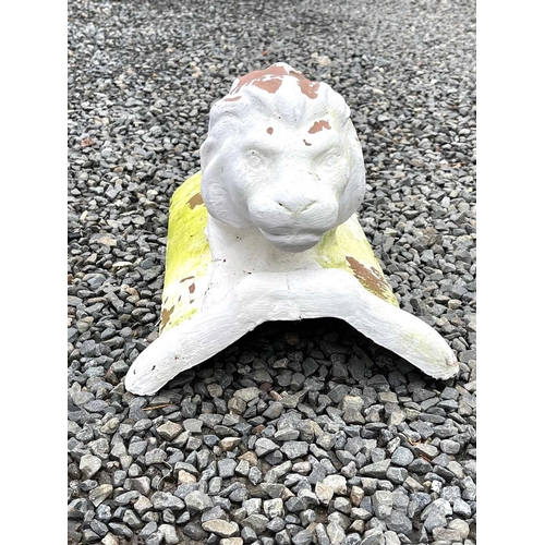 631 - A white painted terracotta roof tile, mounted with a figure of a lion, length 46cm.