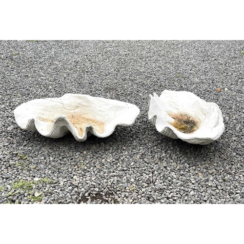 632 - A pair of reconstituted stone garden ornaments of giant clam shell form, width 62cm.