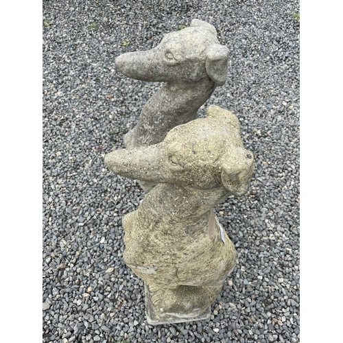 634 - A pair of Churchstone (limestone, sandstone and granite) garden figures of greyhounds, modern, heigh... 