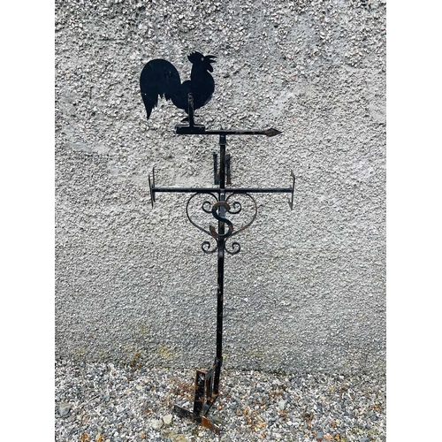 641 - A black painted weathervane, 20th century, mounted with a cockerel, height 133cm.