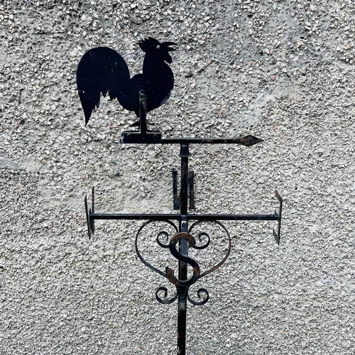 641 - A black painted weathervane, 20th century, mounted with a cockerel, height 133cm.