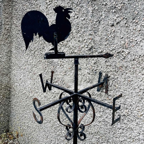 641 - A black painted weathervane, 20th century, mounted with a cockerel, height 133cm.