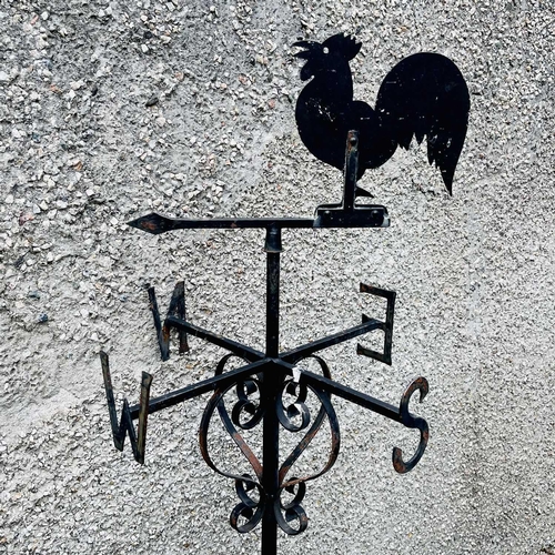 641 - A black painted weathervane, 20th century, mounted with a cockerel, height 133cm.