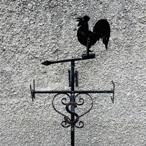 641 - A black painted weathervane, 20th century, mounted with a cockerel, height 133cm.