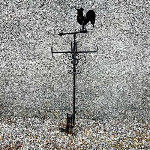 641 - A black painted weathervane, 20th century, mounted with a cockerel, height 133cm.