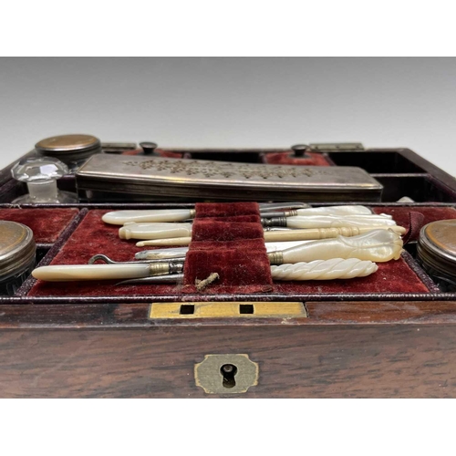 67 - A Victorian dressing case, the interior fitted with a lift out tray containing glass jars with plate... 