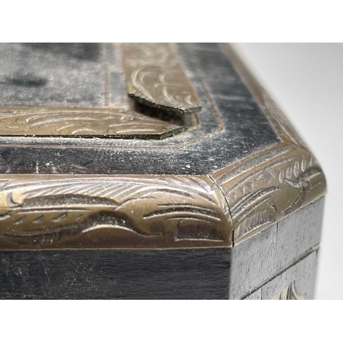 68 - A 19th century ebony and brass inlaid lady`s vanity box, the lid and front with a foliate scroll, br... 