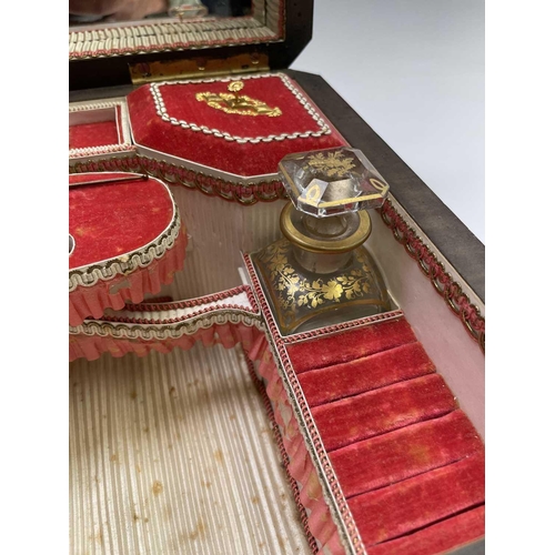 68 - A 19th century ebony and brass inlaid lady`s vanity box, the lid and front with a foliate scroll, br... 