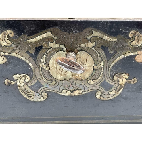 68 - A 19th century ebony and brass inlaid lady`s vanity box, the lid and front with a foliate scroll, br... 