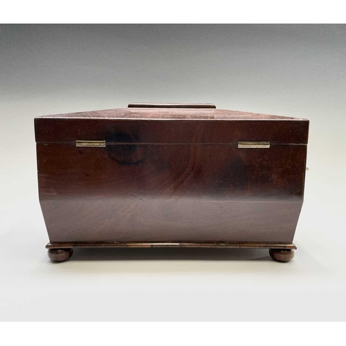 69 - A George III mahogany sarcophagus form tea caddy, with gilt brass handles, the interior with kingwoo... 