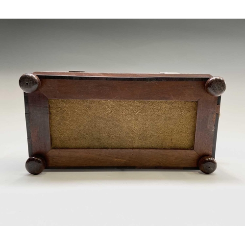 69 - A George III mahogany sarcophagus form tea caddy, with gilt brass handles, the interior with kingwoo... 