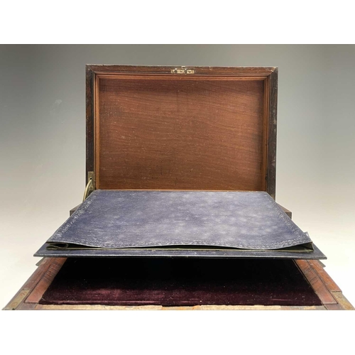 70 - An early Victorian rosewood and brass inlaid writing slope, the interior with tooled leather and vel... 