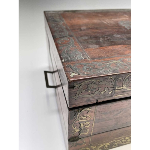 70 - An early Victorian rosewood and brass inlaid writing slope, the interior with tooled leather and vel... 