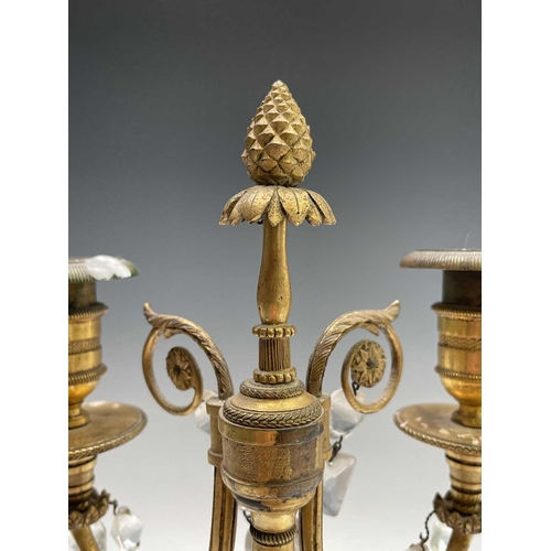 8 - A pair of French bronze and gilt bronze candelabra, 19th century, each with a trumpeting satyr suppo... 