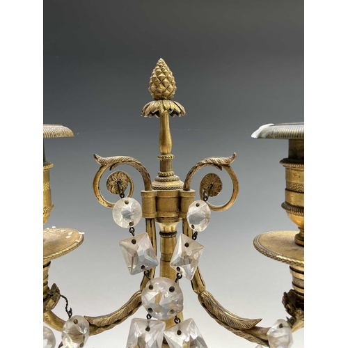 8 - A pair of French bronze and gilt bronze candelabra, 19th century, each with a trumpeting satyr suppo... 