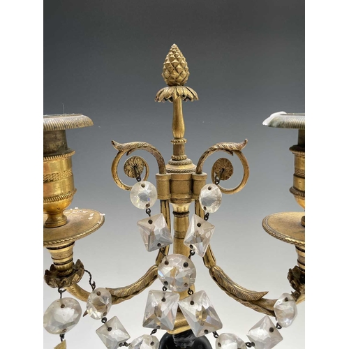 8 - A pair of French bronze and gilt bronze candelabra, 19th century, each with a trumpeting satyr suppo... 