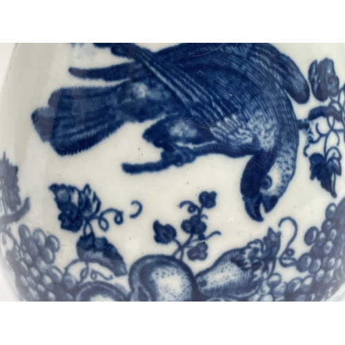 800 - A Worcester blue and white jug, circa 1780, printed in blue with the parrot pecking fruit pattern, w... 