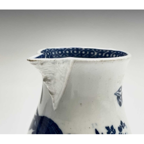 800 - A Worcester blue and white jug, circa 1780, printed in blue with the parrot pecking fruit pattern, w... 