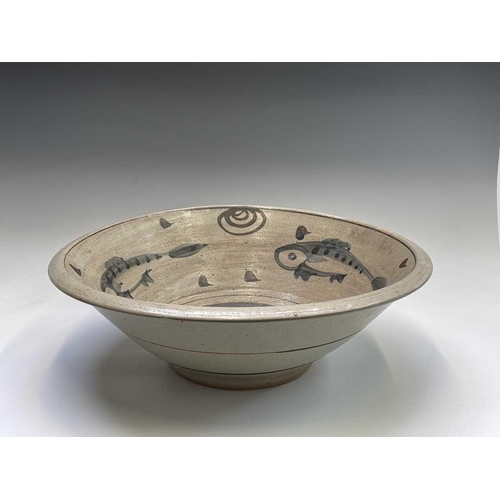 803 - A studio pottery stoneware bowl of large proportions internally painted with three fish. Height 18cm... 