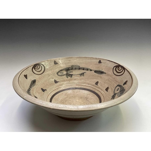 803 - A studio pottery stoneware bowl of large proportions internally painted with three fish. Height 18cm... 